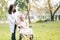 Octor help and care Asian senior or elderly old lady woman patient sitting on wheelchair at park in nursing hospital ward :