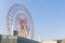 Odaiba colorful tall Palette Town Ferris wheel named Daikanransha visible from the central urban area of Tokyo in the summer blue