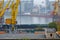 Odesa, Ukraine - OCT 22 2019: Autumn fog in the sea cargo port. Gantry cranes, level luffing cranes in the coal terminal and