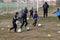 ODESSA, UKRAINE - 03.27.21: Children play football. Little ones go in sports, learn to play football and play in school stadium.