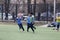 ODESSA, UKRAINE - 03.27.21: Children play football. Little ones go in sports, learn to play football and play in school stadium.