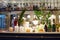 Odessa, Ukraine - 25.08.2019: Empty glasses for wine above a bar rack. Classic bar counter with bottles. Interior of a modern pub