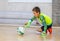 ODESSA, UKRAINE-CIRCA-2020: Children play mini-football. Futsal goalkeeper stands at gate. Sports training of children of football