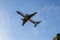 Odessa, Ukraine - CIRKA 2019: Passenger airplane in the air with landing gears lowered before boarding at the airport under