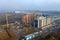 ODESSA, UKRAINE - January 9, 2019: Aerial top view photo from flying drone. Construction site. Large industrial tower cranes.