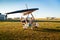 Odessa, Ukraine - July 14, 2016: Young woman standing near a motor hang glider at aerodrome.