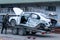 Odessa, Ukraine - March 11th 2020: Tow truck loads white smashed car after traffic accident