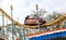 ODESSA, UKRAINE - MAY 6, 2019: Visitors ride road slides in an amusement park. Young friends on an exciting rollercoaster. Young