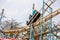 ODESSA, UKRAINE - MAY 6, 2019: Visitors ride road slides in an amusement park. Young friends on an exciting rollercoaster. Young