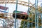 ODESSA, UKRAINE - MAY 6, 2019: Visitors ride road slides in an amusement park. Young friends on an exciting rollercoaster. Young