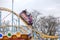 ODESSA, UKRAINE - MAY 6, 2019: Visitors ride road slides in an amusement park. Young friends on an exciting rollercoaster. Young