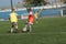 ODESSA, UKRAINE - September 7, 2019: little children in training play soccer. Younger boys kick soccer at the playground. Children