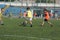 ODESSA, UKRAINE - September 7, 2019: little children in training play soccer. Younger boys kick soccer at the playground. Children