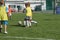 ODESSA, UKRAINE - September 7, 2019: little children in training play soccer. Younger boys kick soccer at the playground. Children