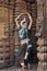 Odissi Dancer wears traditional costume and performs Odissi dance at Mukteshvara Temple,Bhubaneswar, Odisha, India