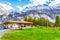 Oeschinnensee lake, wooden chalet, Switzerland.