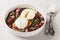 Oeufs en meurette is a traditional dish from Burgundian cuisine based on poached eggs and meurette sauce or bourguignon sauce