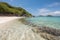 off-the-beaten-path beach with crystal clear waters and soft sand