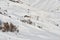 Off piste ski areas between the slopes in Les Sybelles ski domain, France, on a bright sunny Winter day. Aerial view.