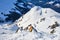 Off piste ski terrain in Arosa Lenzerheide resort, Switzerland, with a touristic marker on a rock. Scenery, mountain ridge, Winter