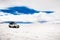 Off-road car driving through Salar de Uyuni salt flat in Bolivia