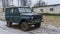 Off-road military light utility vehicle. Old Soviet car with in countryside.