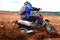 Off-road motorbike cornering in dirt