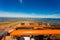 Off road orange truck on top mountain and blue sky