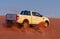 Off-road safari on the golden sands of the desert on a white car in Walvis Bay. Namibia