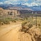 Off road trail with cliffs and La Sal Mountain