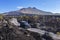 Off road vehicle moving near solidified lava flows