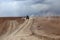 An off road vehicle running in the dusty of desert. Adventure in Bolivia highlands in the Andes.