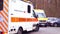 Offenbach, Germany - January 2022: modern Red paramedic ambulance emergency service vehicle, medics provide assistance, concept of