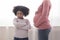 Offended Black Little Girl Standing Turned From Her Pregnant Mother`s Belly