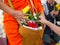 Offer sacrifice flowers to monk