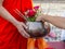 Offer sacrifice flowers to monk