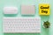 Office accessories, evenly arranged, computer keyboard, portable disk, mouse, sticky the words `Good Day` Comcept, Positive attitu