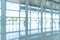 Office building lobby hall blur background or blurry school hallway corridor interior view looking toward empty entrance