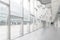 Office building or university lobby hall blur background with blurry school hallway corridor interior view toward empty corridor