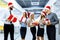 Office Christmas party. group of joyful colleagues in Santa Claus hats, with Christmas gifts, having fun and celebrating the New