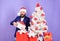 Office christmas party. Winter holidays. Christmas greetings. Best gifts shop. Man bearded hipster formal suit near