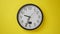 Office Clock Hanging on a Yellow Color Wall, Timelapse