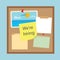 Office cork board with reminder notepapers and we are hiring written on sticky note