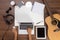 Office desk background hand using a laptop acoustic guitar and headphones