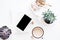 office desk flat lay with coffe, smartphone and succulents, clea