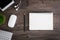 The office desk flat lay view with keyboard, mouse, tree, book, pencil and earphone on wood texture background