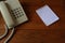 Office desk with notebook, telephone, pen on top view.