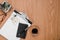 Office desk notes details in a wooden background close up