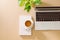 Office desk table with laptop, smart phone, cup of coffee, pen, pencil and notebook. Office supplies and gadgets on desk table.