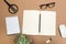 Office desk table with  notebook scissors glasses succulent and pencil. Mock up template . Top view.- Image